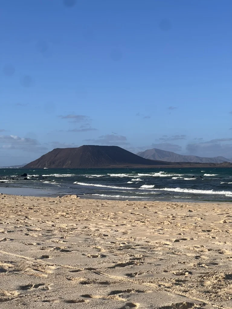 Isla de Lobos across a wavy blue sea